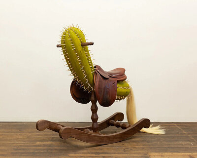 raul de lara carves surreal wooden sculptures to question who gets to belong