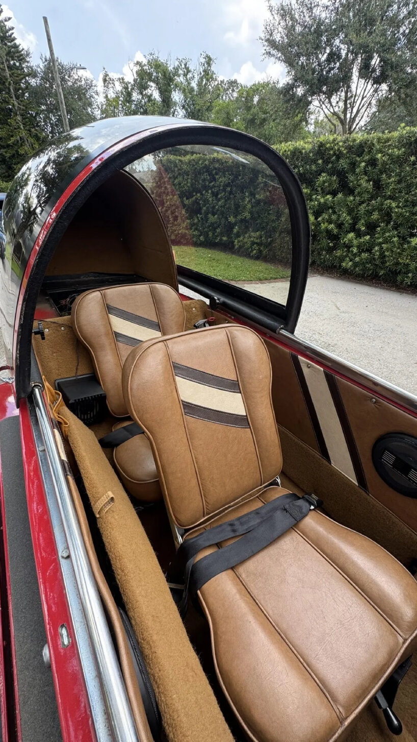 there are tandem seats in the cabin of the automobile