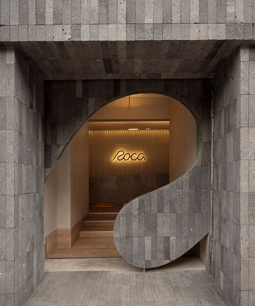 granite and fabric shape an interplay of solidity and fluidity at roca pilates studio in mexico
