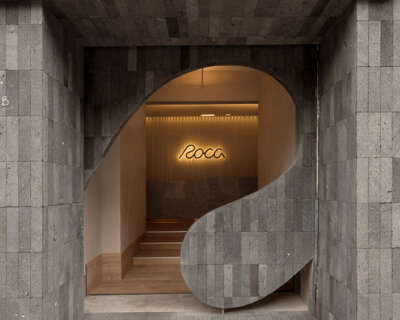 granite and fabric shape an interplay of solidity and fluidity at roca pilates studio in mexico