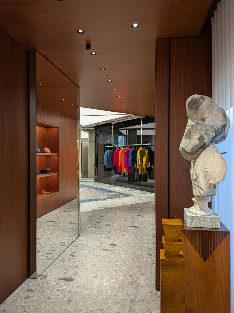 visitors walk around and find Romanesque sculptures throughout the boutique | image © designboom