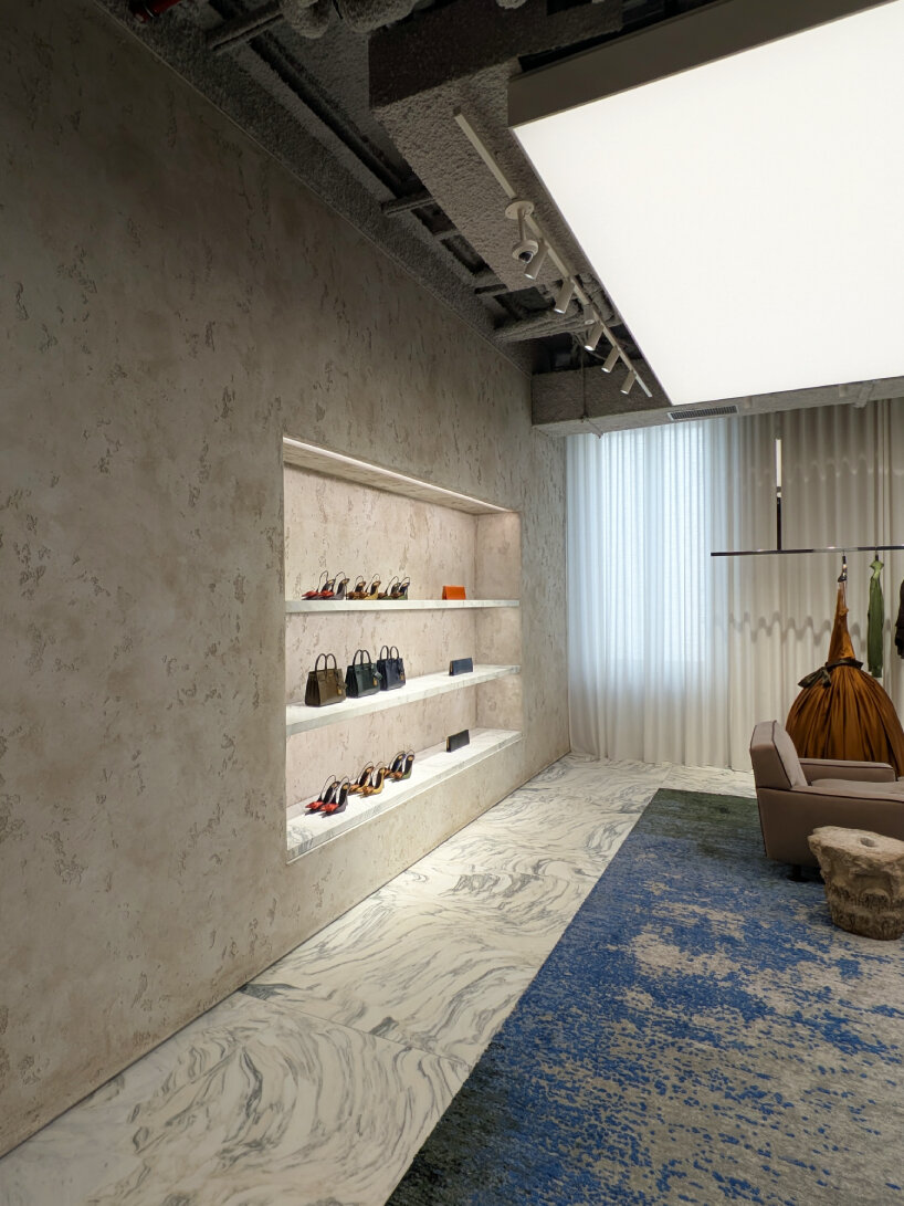 the carpets designs are inspired by pixelated images using threads and Monet's painting | image © designboom