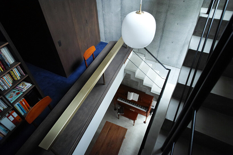 semi-cylindrical roof brings daylight into AOIM's three-story residence in tokyo