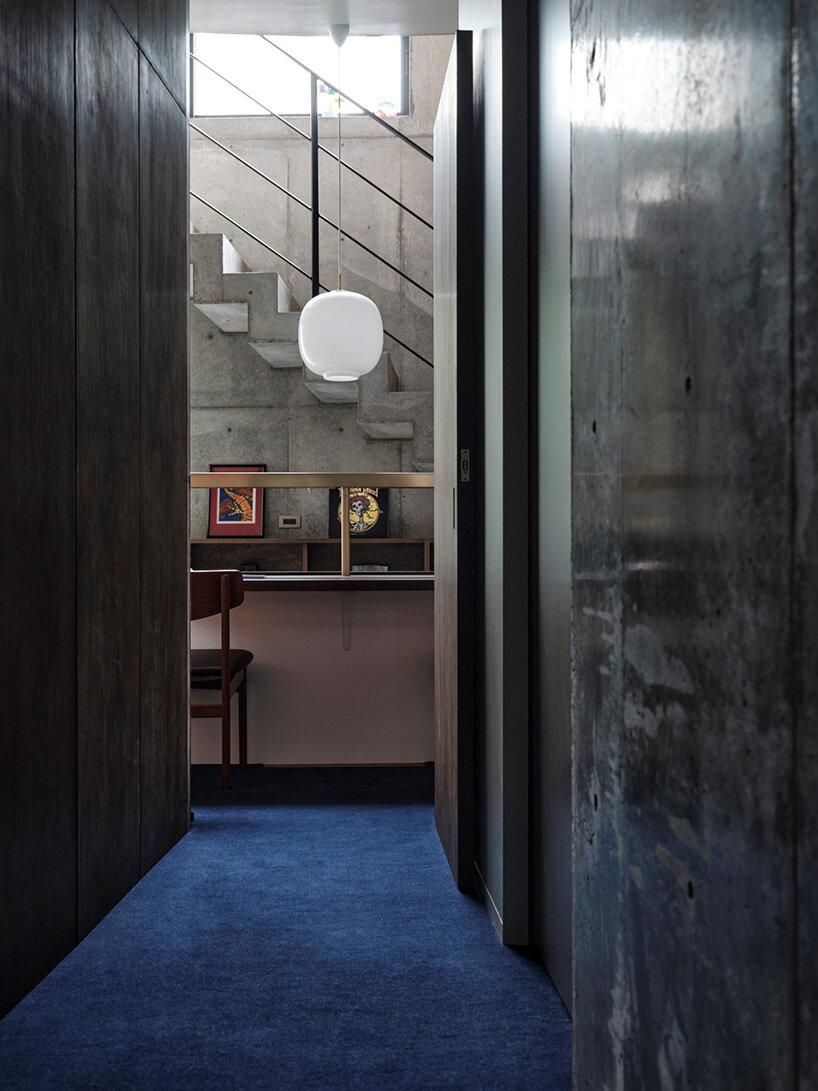 semi-cylindrical roof brings daylight into AOIM's three-story residence in tokyo