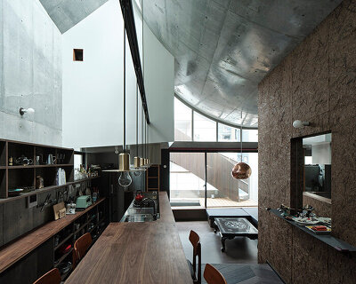 semi-cylindrical roof brings daylight into AOIM's three-story residence in tokyo