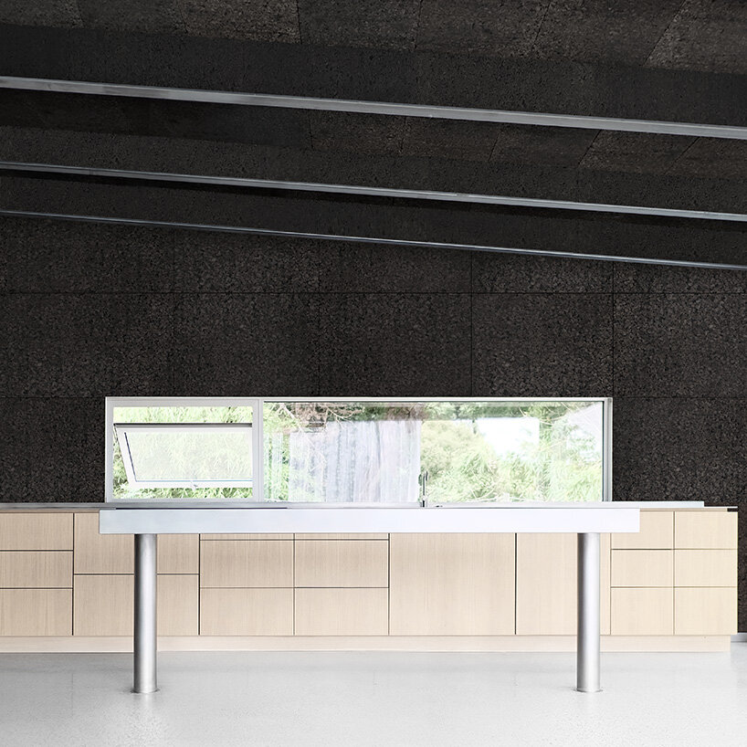 sliding curtains veil ecological cork-clad residence by mesure studio in brittany, france