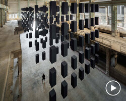 SpY's suspended grid installation of black rectangles floats within turbine factory in hungary