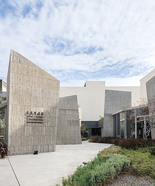 ten inclined concrete volumes outline stonehenge lodge real estate sales center in taiwan
