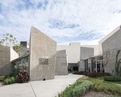 ten inclined concrete volumes outline stonehenge lodge real estate sales center in taiwan