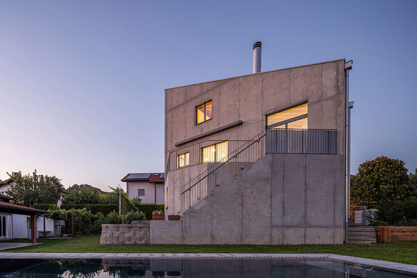 cuts and voids carve swisshouse xl's solid octagonal block by davide macullo architects