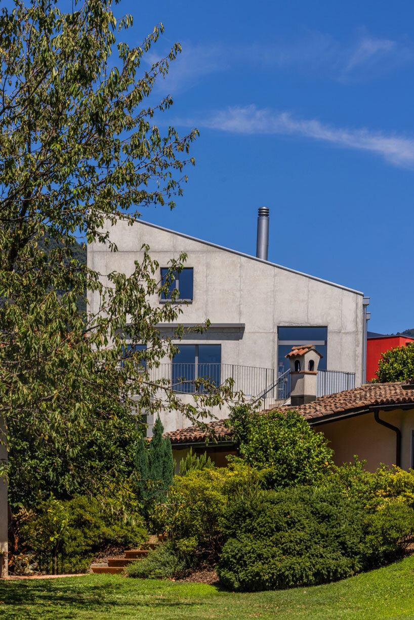 cuts and voids carve swisshouse xl's solid octagonal block by davide macullo architects