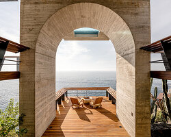 zozaya arquitectos designs home with swimming pool suspended over mexico's pacific coast