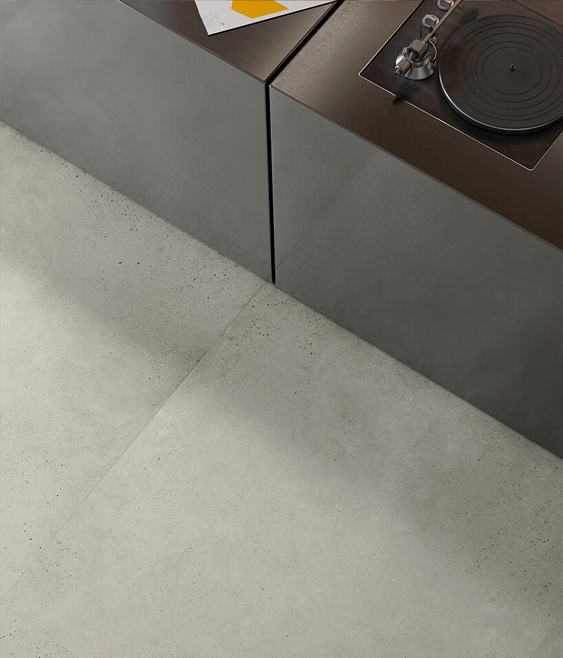 ariostea’s mūra surfaces translate concrete into a unified porcelain stoneware system