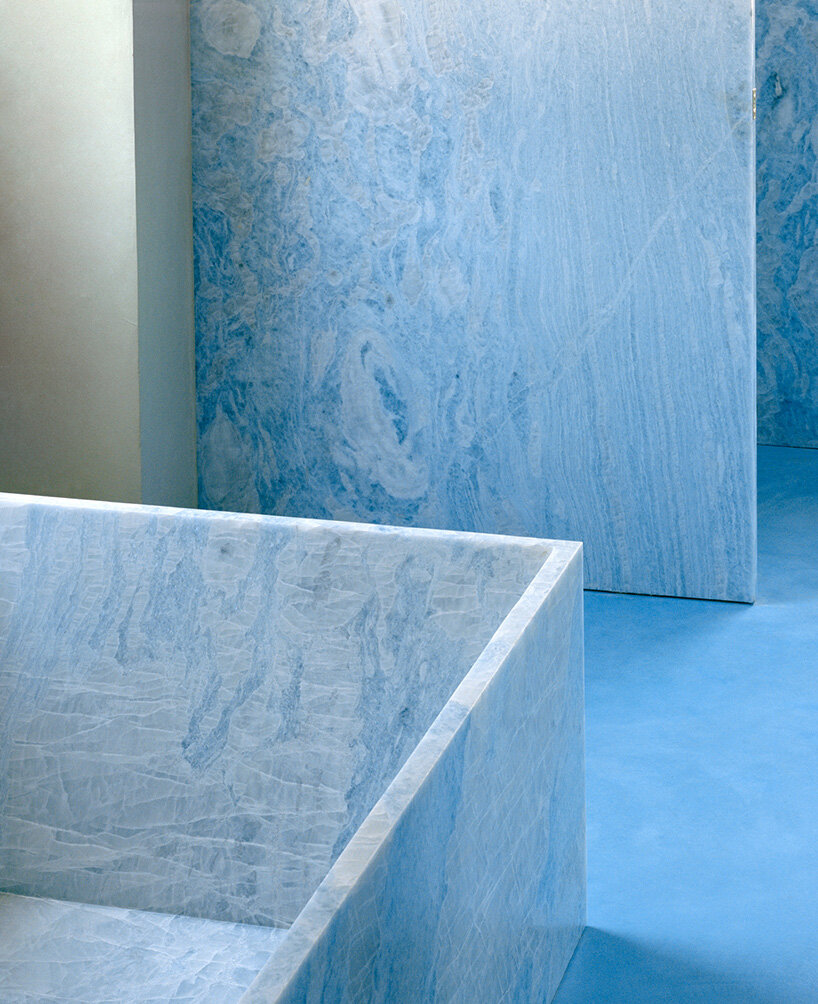 arquitectura-G embeds blue concrete core with spiraling staircase in portuguese residence