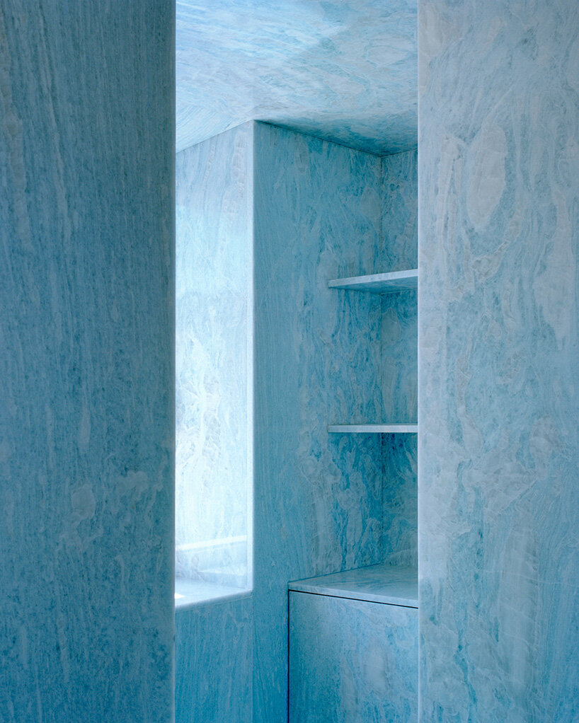 arquitectura-G embeds blue concrete core with spiraling staircase in portuguese residence