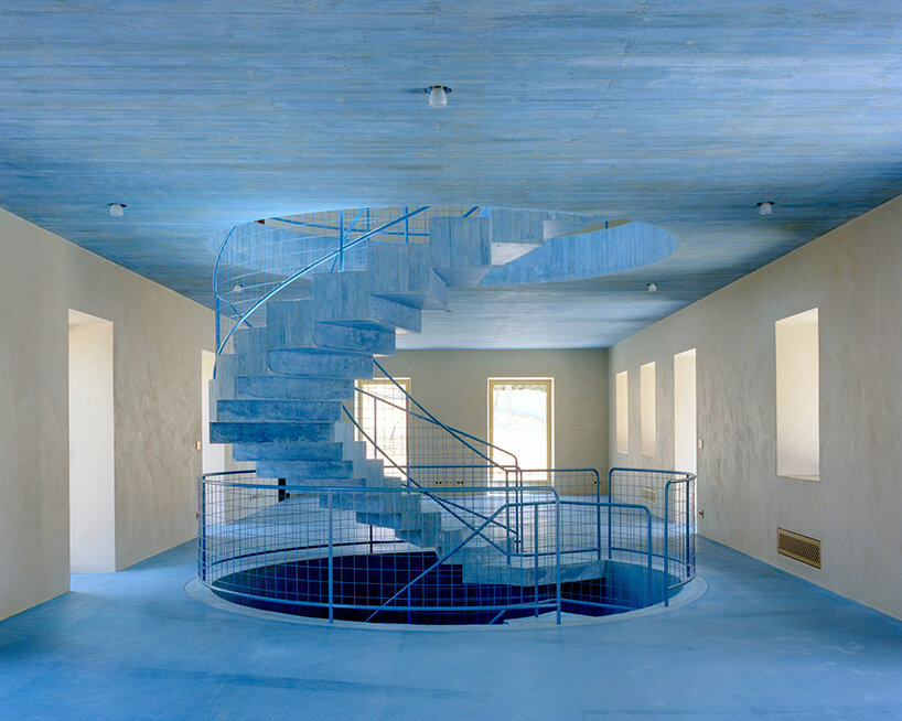 arquitectura-G embeds blue concrete core with spiraling staircase in portuguese residence