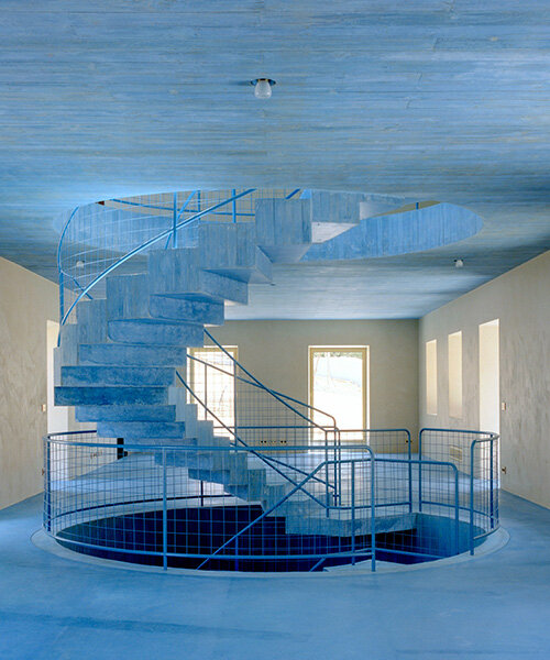 arquitectura-G embeds blue concrete core with spiraling staircase in portuguese residence