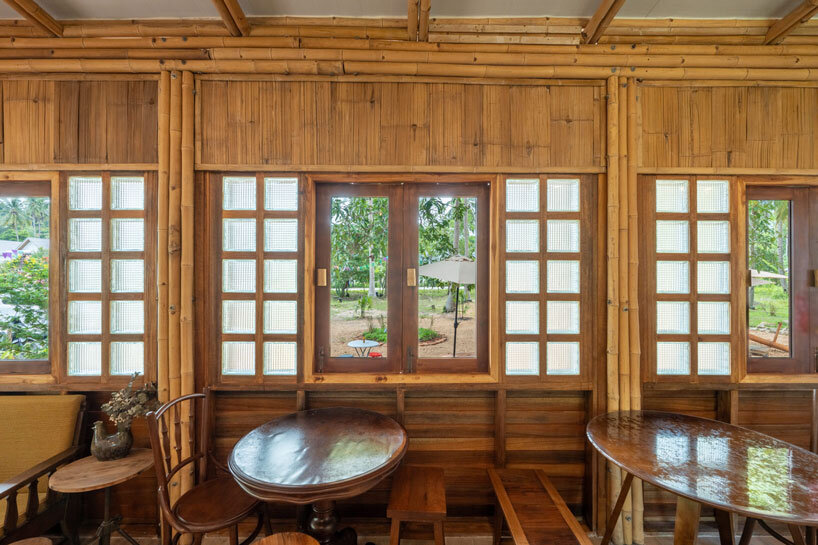 bamboo-clad ice cream shop tucks within coconut grove in thailand
