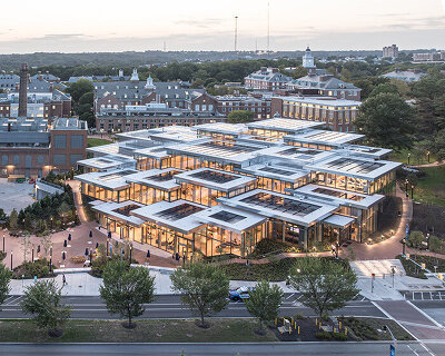 BIG & rockwell group design johns hopkins center as 'climbing village' of clustered boxes