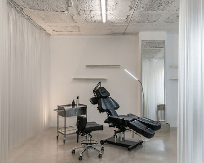blok tattoo studio in barcelona redefines sterile spaces through concrete and steel interiors