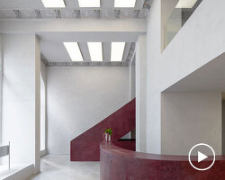 parabolic structures painted in burgundy stucco outline stockholm flagship for chimi eyewear