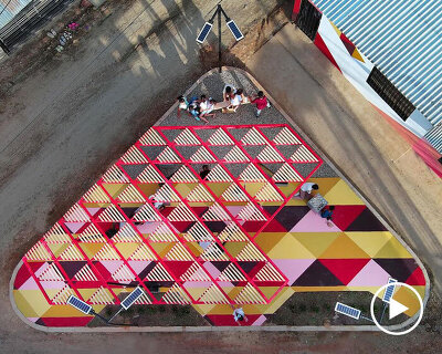 recycled materials transform abandoned triangular lot in colombia into colorful urban space