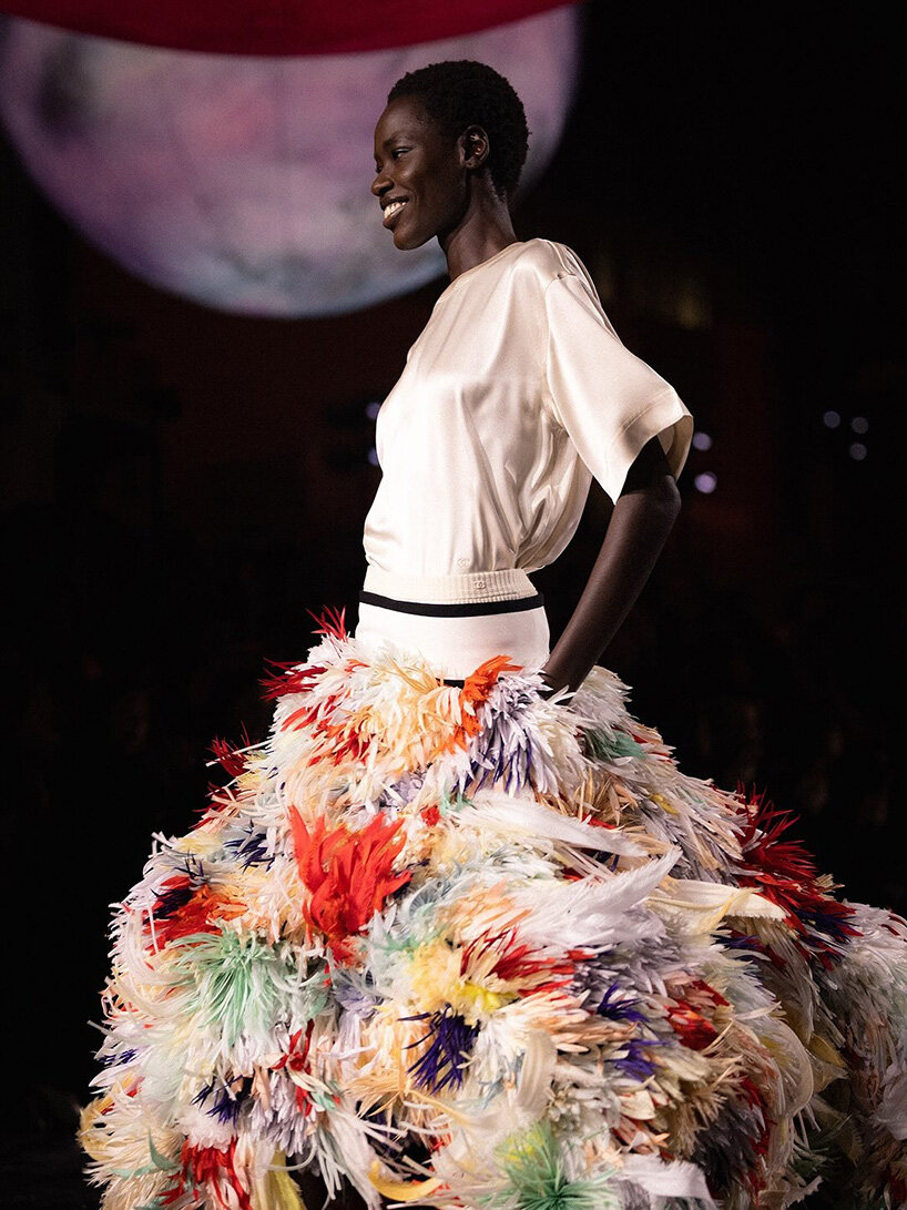 constellation of floating orbs illuminates paris's grand palais for chanel SS26 show