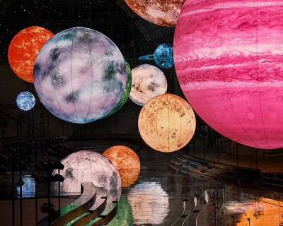 constellation of floating orbs illuminates paris's grand palais for chanel SS26 show