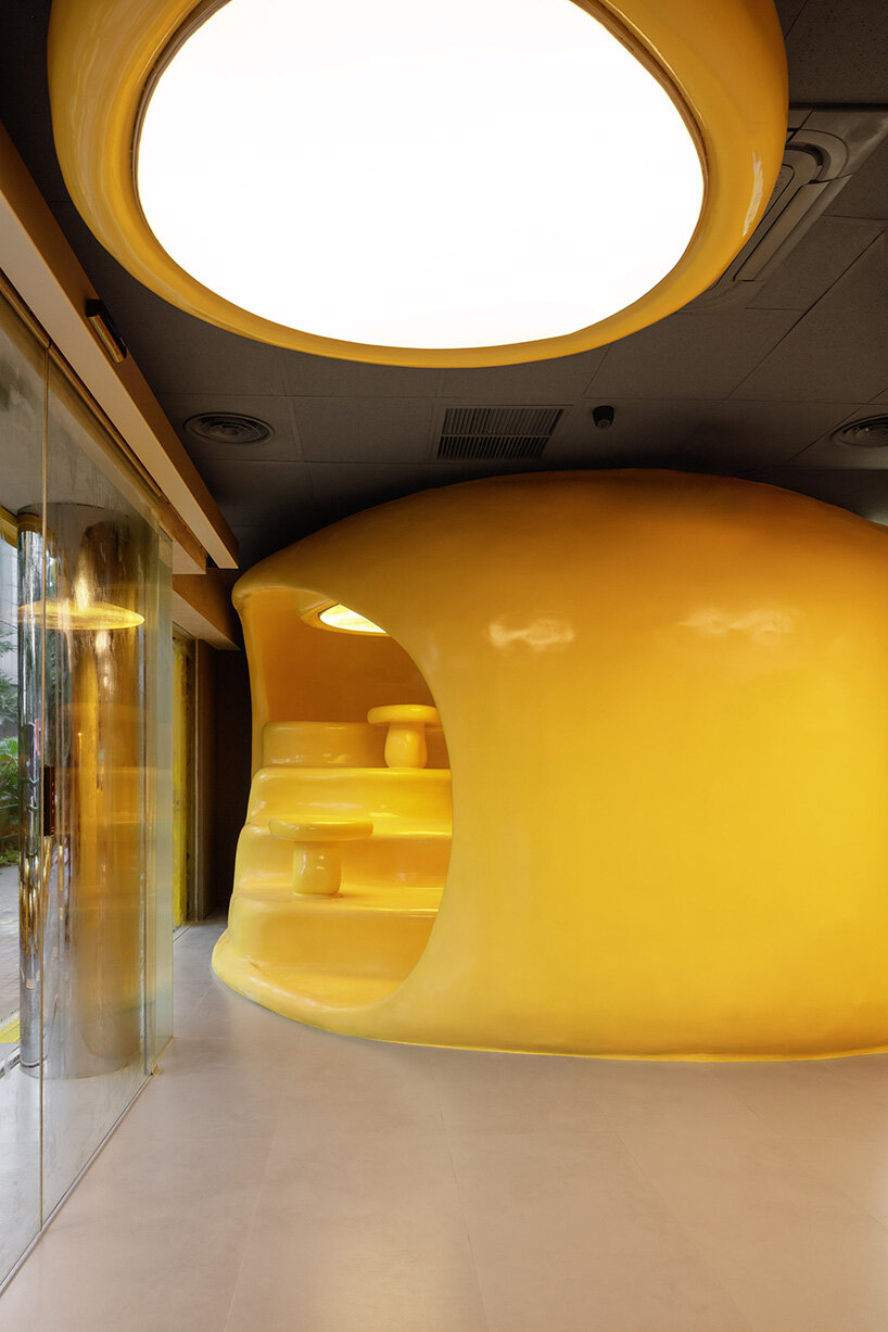 crosby studios composes bright yellow alien habitat for dessert shop in jakarta