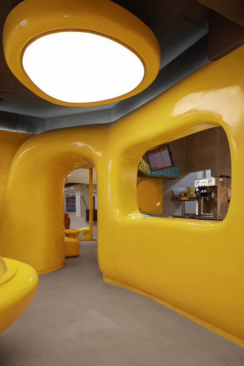 crosby studios composes bright yellow alien habitat for dessert shop in jakarta