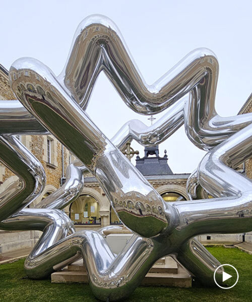 cyril lancelin's inflatable sculpture of star loops reflects the courtyard of étrépagny library