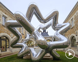 cyril lancelin's inflatable sculpture of star loops reflects the courtyard of étrépagny library