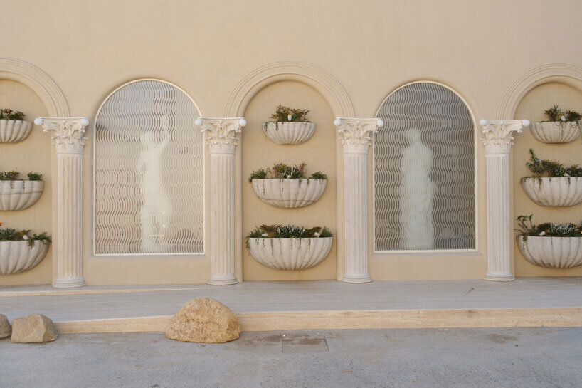 dessert-shaped sculptures in marble and wood ornament ice cream shop in argentina