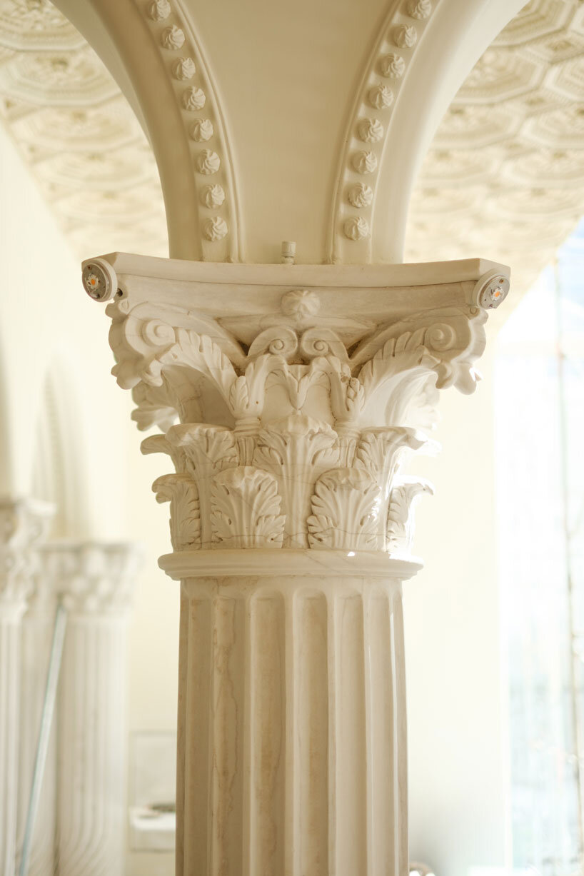 dessert-shaped sculptures in marble and wood ornament ice cream shop in argentina