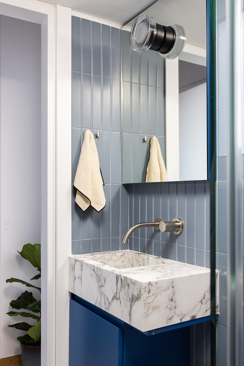 glass blocks and marble surfaces illuminate the renovation of 1960s athens penthouse