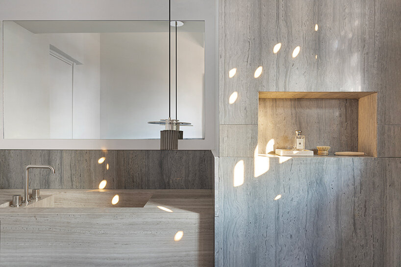 glass blocks and marble surfaces illuminate the renovation of 1960s athens penthouse