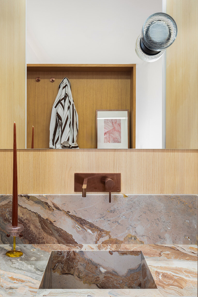 glass blocks and marble surfaces illuminate the renovation of 1960s athens penthouse