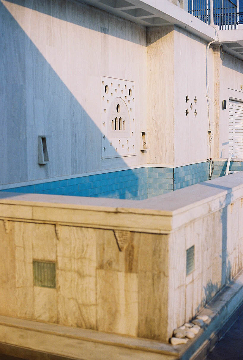 glass blocks and marble surfaces illuminate the renovation of 1960s athens penthouse