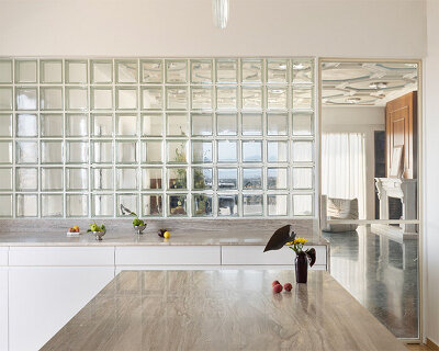 glass blocks and marble surfaces illuminate the renovation of 1960s athens penthouse