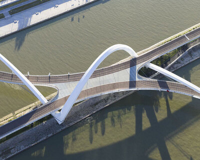 zaha hadid architects draws from silk embroidery of hangzhou with serpentine footbridge