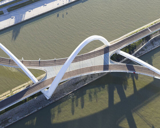 zaha hadid architects draws from silk embroidery of hangzhou with serpentine footbridge