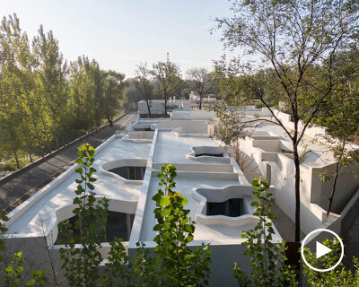 cluster of interwoven white courtyard houses reinterprets ancient kilns for resort in china