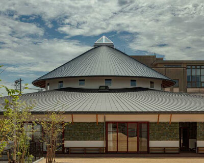 curved wooden frame shapes light-filled daycare center in japan encouraging playful learning