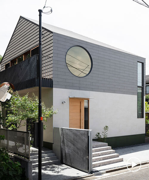 circular aperture welcomes natural light within gabled tokyo house by KIAS