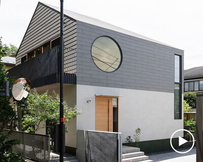 circular aperture welcomes natural light within gabled tokyo house by KIAS