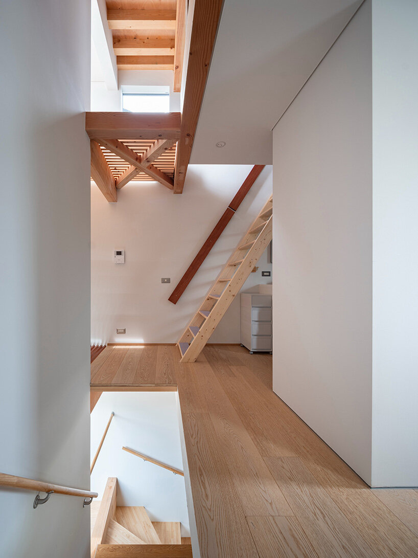 layered wood and copper forms wrap compact residence by shin aoki and partners in tokyo