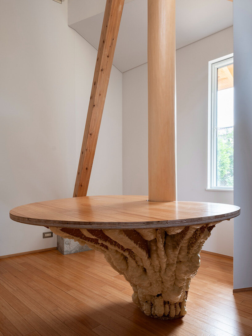 layered wood and copper forms wrap compact residence by shin aoki and partners in tokyo