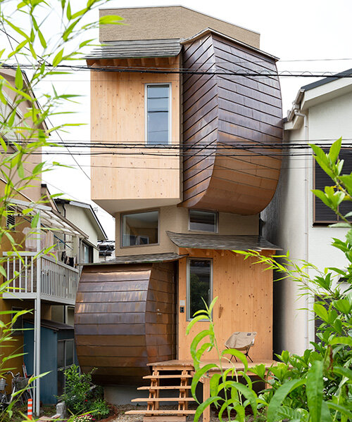 layered wood and copper forms wrap compact residence by shin aoki and partners in tokyo