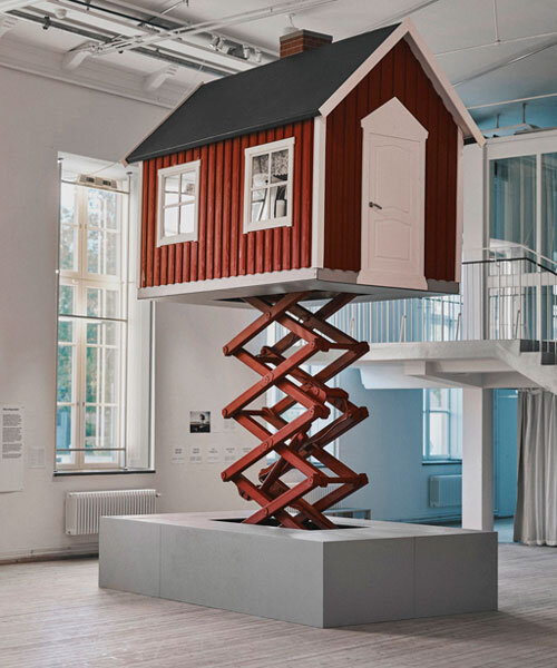 ulf mejergren builds mobile red cottage on scissor lift as a response to climate change
