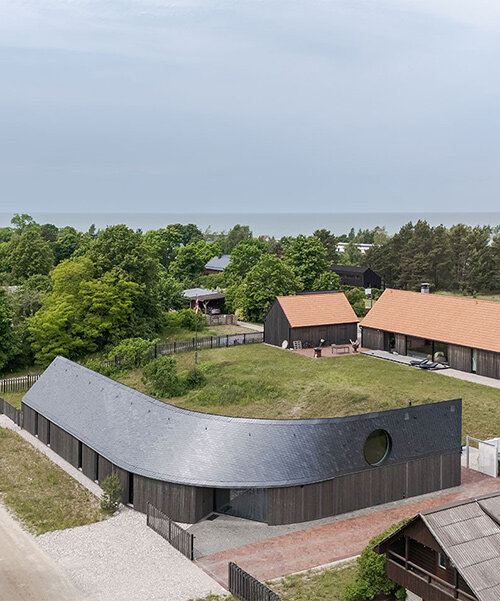 MADE arhitekti's twisting pāvilosta house seems to be carved by latvia's coastal winds
